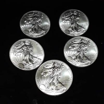 5 American silver eagles.  2012 Reserve set