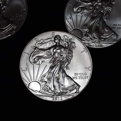 5 American silver eagles.  2012 Reserve set