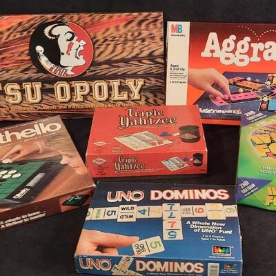 Lot 198  Board Games (Qty 7) FSU Opoly, Aggravation, Triple Yahtzee, UNO Dominos, etc.