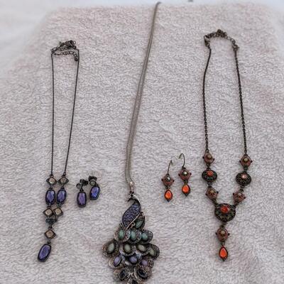 Two beautiful necklace and earring sets and an awesome Peacock Necklace