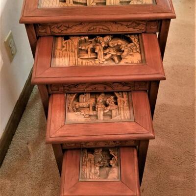 Lot #126  Set of 4 Nesting Tables with Carved Wooden Scenes