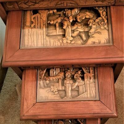 Lot #126  Set of 4 Nesting Tables with Carved Wooden Scenes