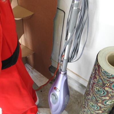 Shark steam cleaner and roll of wallpaper