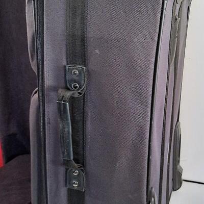 Lot 213  Samsonite Large Gray Suitcase on Rollers.  Lock & Keys.