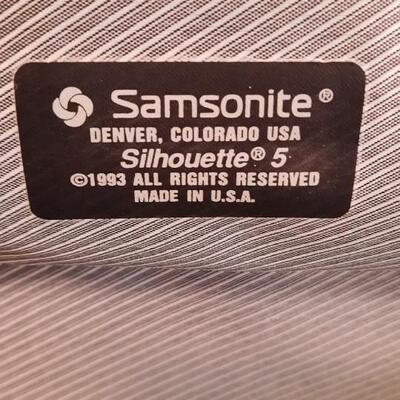 Lot 214  Samsonite Hard Sided Suitcase on Rollers.