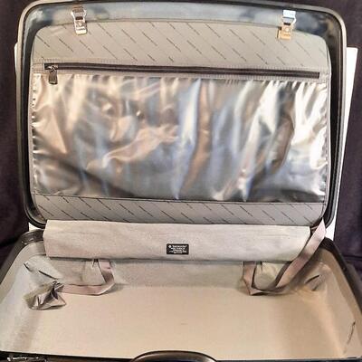 Lot 214  Samsonite Hard Sided Suitcase on Rollers.