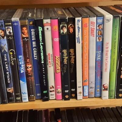 Lot 227   Movie Lover #5 DVDs & Rack. Lots of Family Titles.