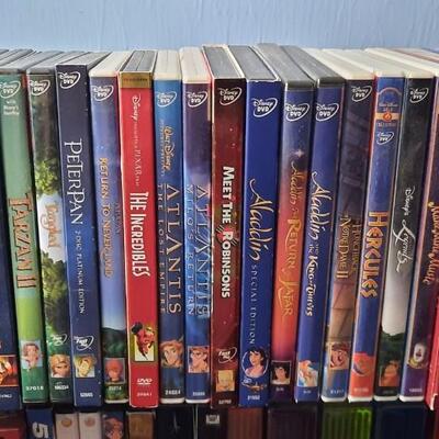 Lot 228   Movie Lover #6  DVDs -Disney & Sets With Rack
