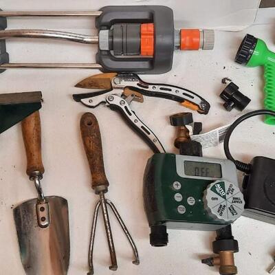 Lot 241  Garden Gear: Sprinkler, Nozzles, Weed Hound, Spade, & Hand Tools