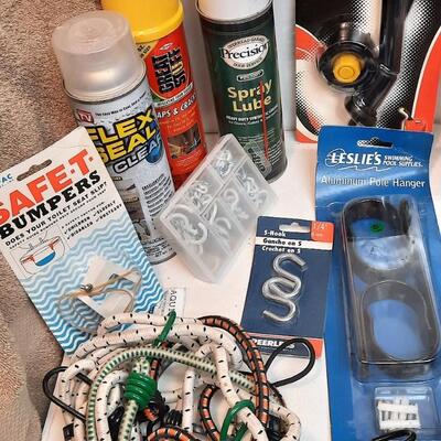 Lot 255  Garage Miscellaneous Bin: Flex Seal, Caulk Gun, Ratchet Strap, Bungee Cords, & More
