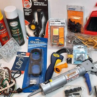 Lot 255  Garage Miscellaneous Bin: Flex Seal, Caulk Gun, Ratchet Strap, Bungee Cords, & More