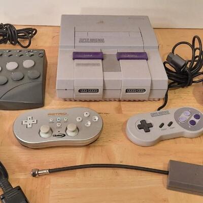 Lot 324  Super Nintendo Console, Retro Controller, Super Controller, Joystick Controller & Adapters