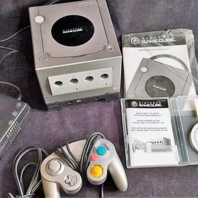 Lot 329  Nintendo Game Cube Console w/ Controller, Adapter, Instruction Booklet & Disk.