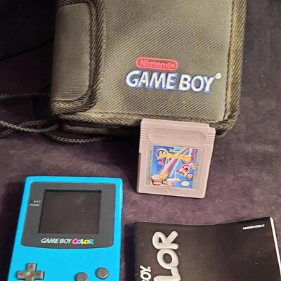 Lot 333  Nintendo Game Boy Color, Carry Case, Instruction Booklet, & Disney Hercules Game Included