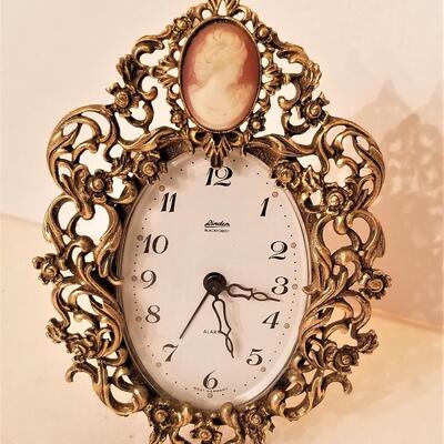 Lot #154  Vintage Alarm/Vanity Clock with Cameo inset - works