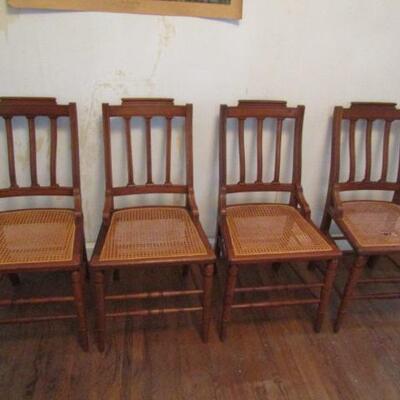 Four Wooden Chairs with Cane Seats