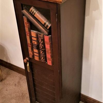 Lot #206  Contemporary Storage Cabinet with Book Motif