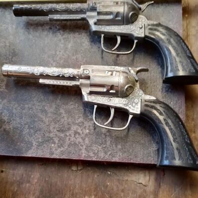 LOT 57  TWO VINTAGE CAP GUNS WITH DOUBLE HOLSTER