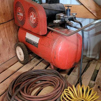 Lot 80: Vintage Montgomery Ward HEAVY DUTY Air Compressor w/ (3) Different Air Hoses Included