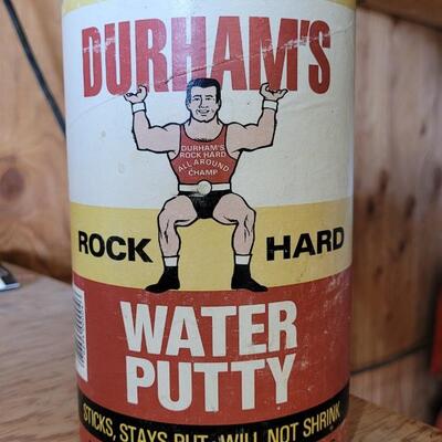 Lot 82: Vintage Advertising Lithograph Print Tin MUSCLE MAN -Durham's Water Putty