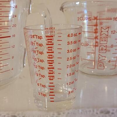 Lot 121: Kitchen Assortment- Measuring Cups, Cruet Bottle, Salt & Pepper Mill and Grater