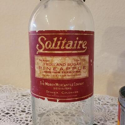 Lot 163: Antique Coffee Grinder, Solitaire Coffee Tin and Fruit & Sugar Pineapple Glass Jar