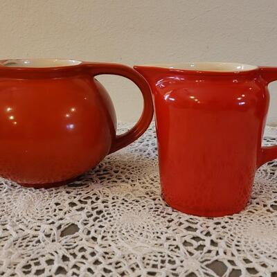 Lot 180: Vintage Universal Cambridge Red & Cream Pitchers