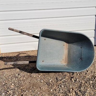Lot 192: Vintage Fiberglass Green Wheelbarrow