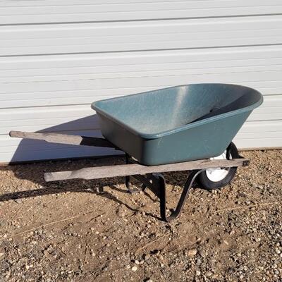Lot 192: Vintage Fiberglass Green Wheelbarrow