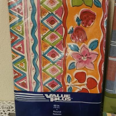 Lot 228: Vintage Napkins, 3 Sets of Placemats and 2 Vinyl Tablecloths