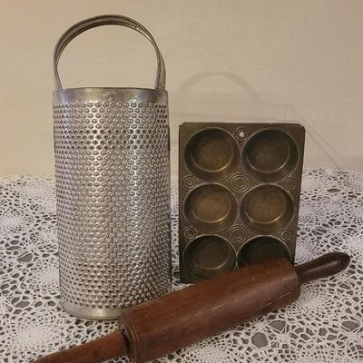Lot 244: Vintage Baking Lot - Extra Large Grater, Wood Rolling Pin and Muffin Pan