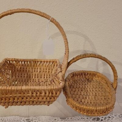 Lot 247: (2) Raffia Baskets and (1) Large Basket with Leather Handles