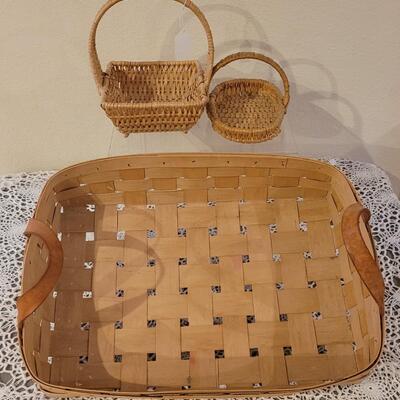 Lot 247: (2) Raffia Baskets and (1) Large Basket with Leather Handles
