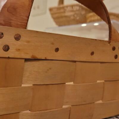 Lot 247: (2) Raffia Baskets and (1) Large Basket with Leather Handles