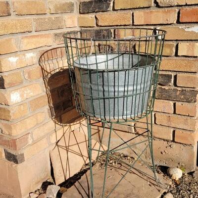 Lot 44: Vintage Metal Plant Stand w/ Vintage Farmhouse Egg/Milking/Baby Bath Bucket Inside