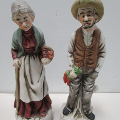 Porcelain Figures Elderly Man and Older Woman Carrying Apples