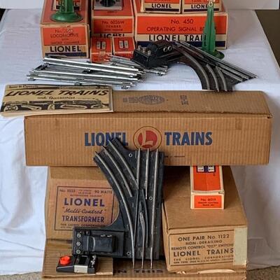 Lot 402: Lionel Trains: Transformer, Tracks, Barrel Loader, Signals and More