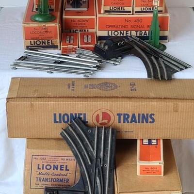 Lot 402: Lionel Trains: Transformer, Tracks, Barrel Loader, Signals and More