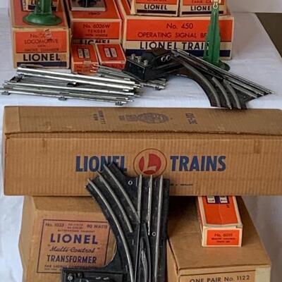 Lot 402: Lionel Trains: Transformer, Tracks, Barrel Loader, Signals and More