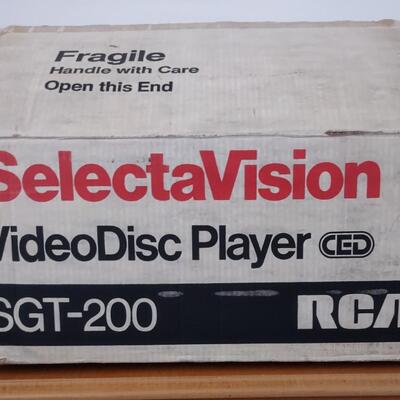 Lot 363: RCA Select A Vision Video Disc Player With Video Discs & Box