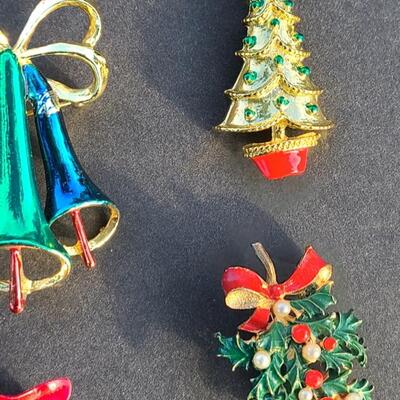 Lot 501: Vintage Holiday Brooches: Rudolph, Santa, Poinsettia and More