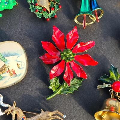 Lot 501: Vintage Holiday Brooches: Rudolph, Santa, Poinsettia and More