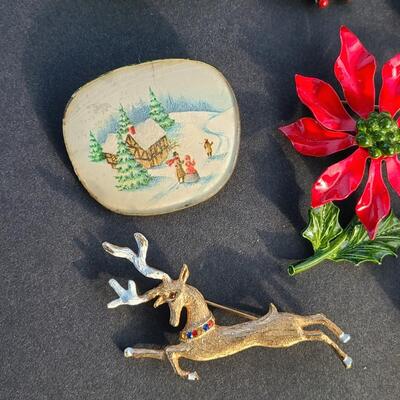Lot 501: Vintage Holiday Brooches: Rudolph, Santa, Poinsettia and More