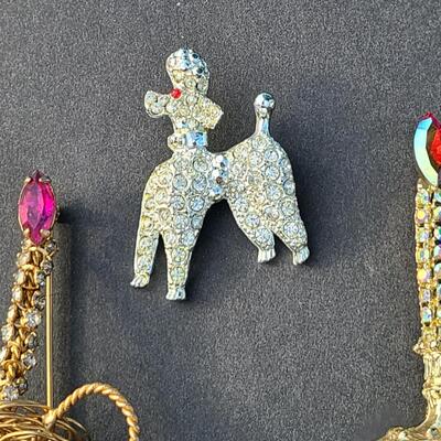 Lot 411: Vintage Rhinestone Poodle and Candlestick Brooches