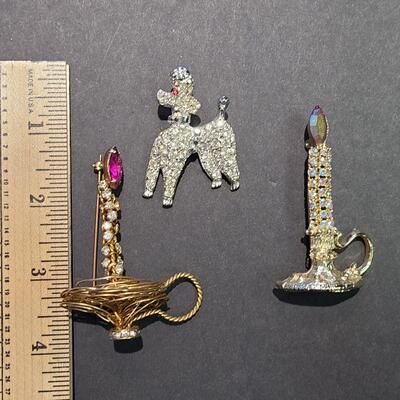 Lot 411: Vintage Rhinestone Poodle and Candlestick Brooches