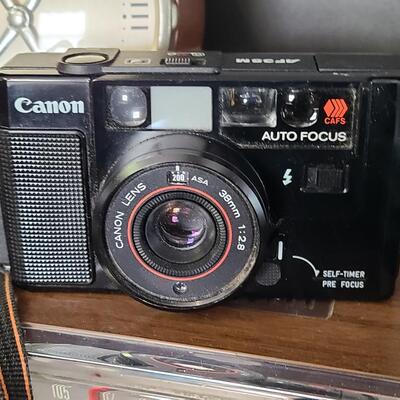 Lot 428: MCM Vintage GE Working Radio, Canon Camera and More