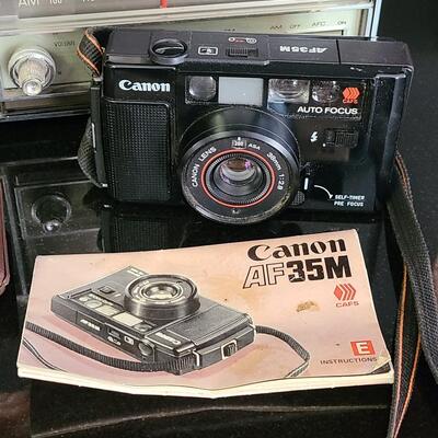 Lot 428: MCM Vintage GE Working Radio, Canon Camera and More
