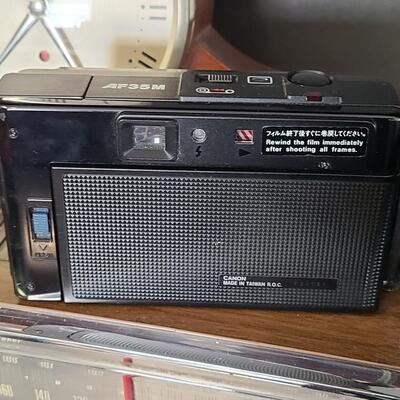 Lot 428: MCM Vintage GE Working Radio, Canon Camera and More