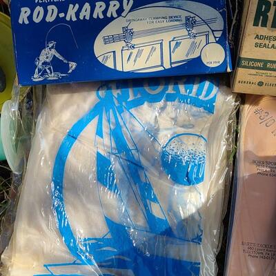 Lot 421: Vintage Fishing Supplies: Igloo Fishing Cooler, New Salt Water Reel and More