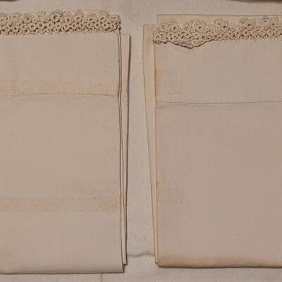 Lot 132: Vintage Handmade Crochet Edge Blue Pillowcases, Eggshell Pillowcases (was tape residue) and (2) White Full Flat Sheet